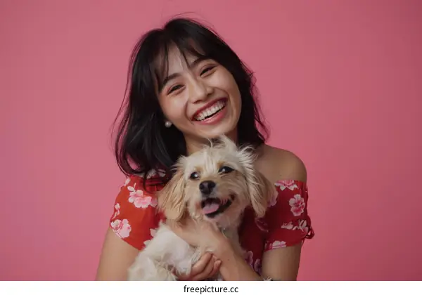 Asian woman with dog smiling at camera
