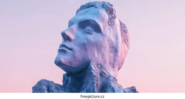 Stone Face Sculpture Against Purple Sky