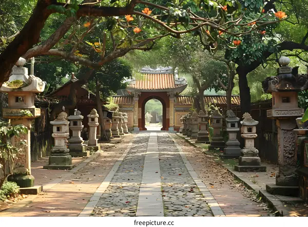 Stone lanterns and trees in the Tu Duc Tomb, Hue, Vietnam