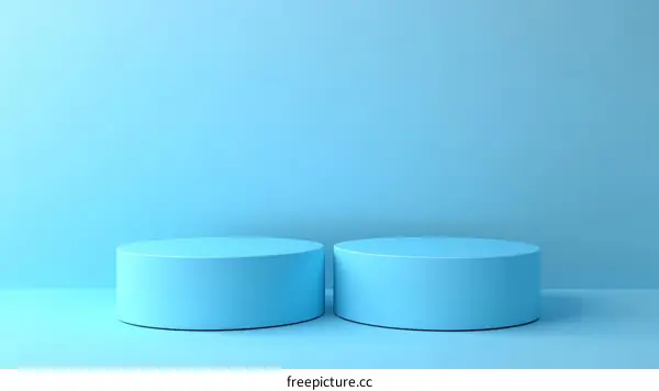 Two Light Blue Cylindrical Product Display Stands