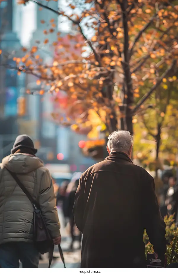 People Walking on a Busy Street in the City with Autumn Leaves