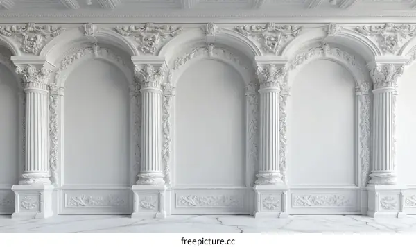 White wall with arched niches and marble floor