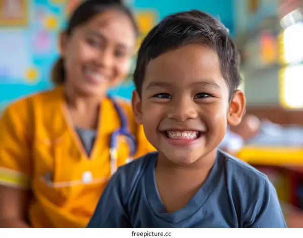 Happy Asian boy smiling with female doctor in background