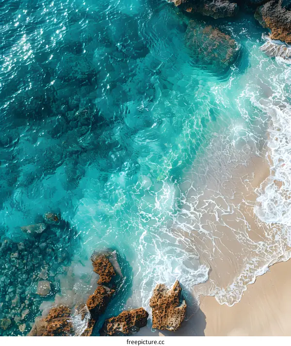 Aerial View of Blue Ocean Water and White Sand Beach