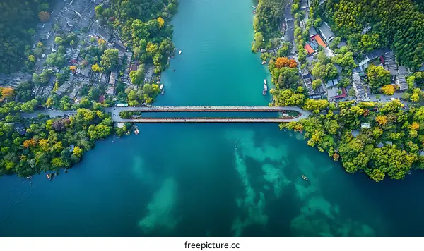 Aerial View of Lakeside Town with Bridge