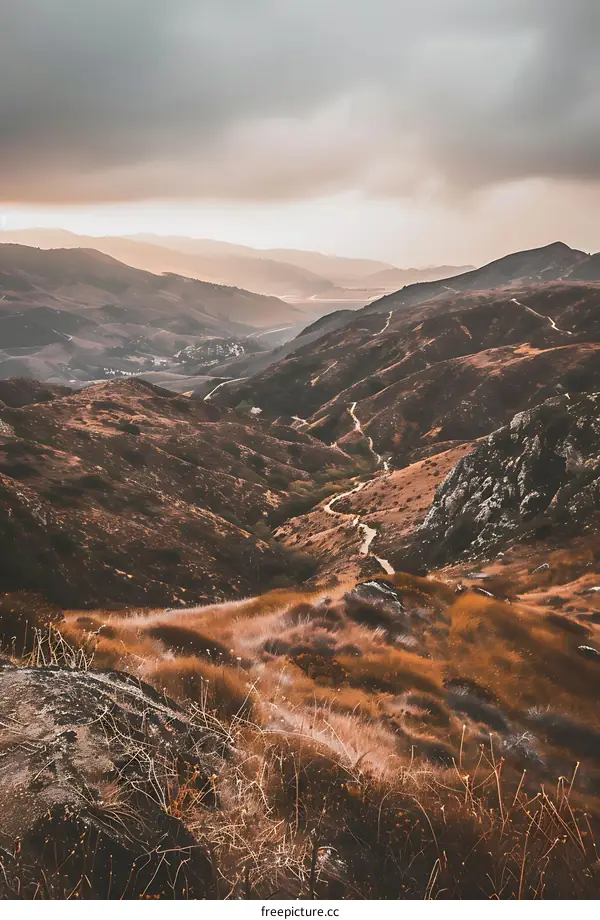 Hiking Trail Through The Hills On A Cloudy Day