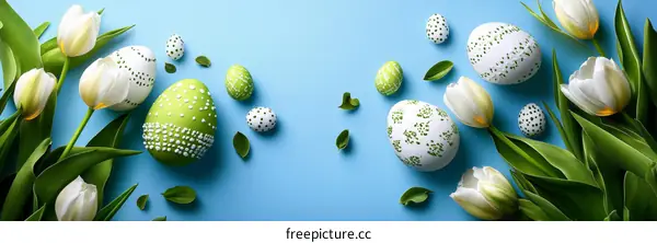 Easter Eggs and Tulips on a Light Blue Background