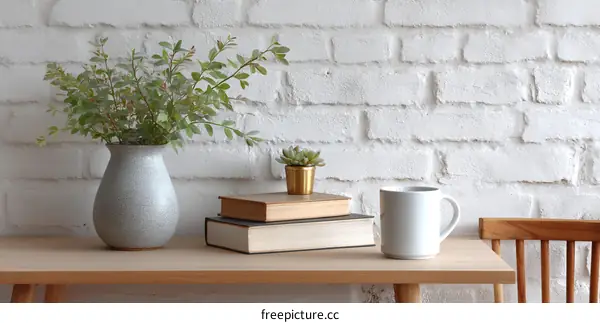 Cozy Home Decor Display with Vase, Books, and Coffee Mug