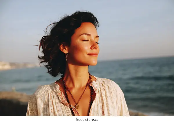 Peaceful Woman by the Ocean at Sunset