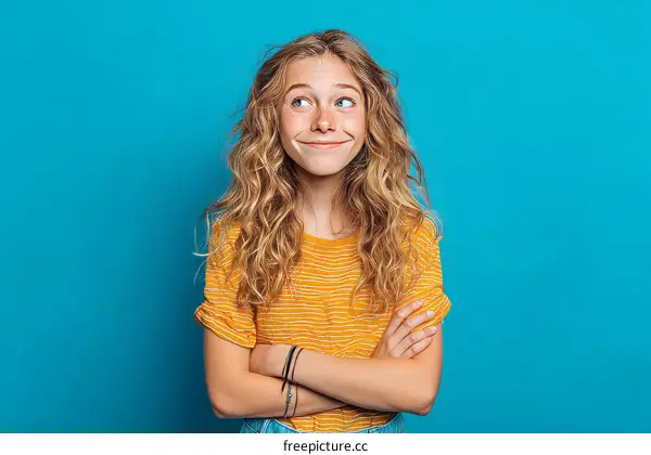 Teenage girl with thoughtful expression studio portrait
