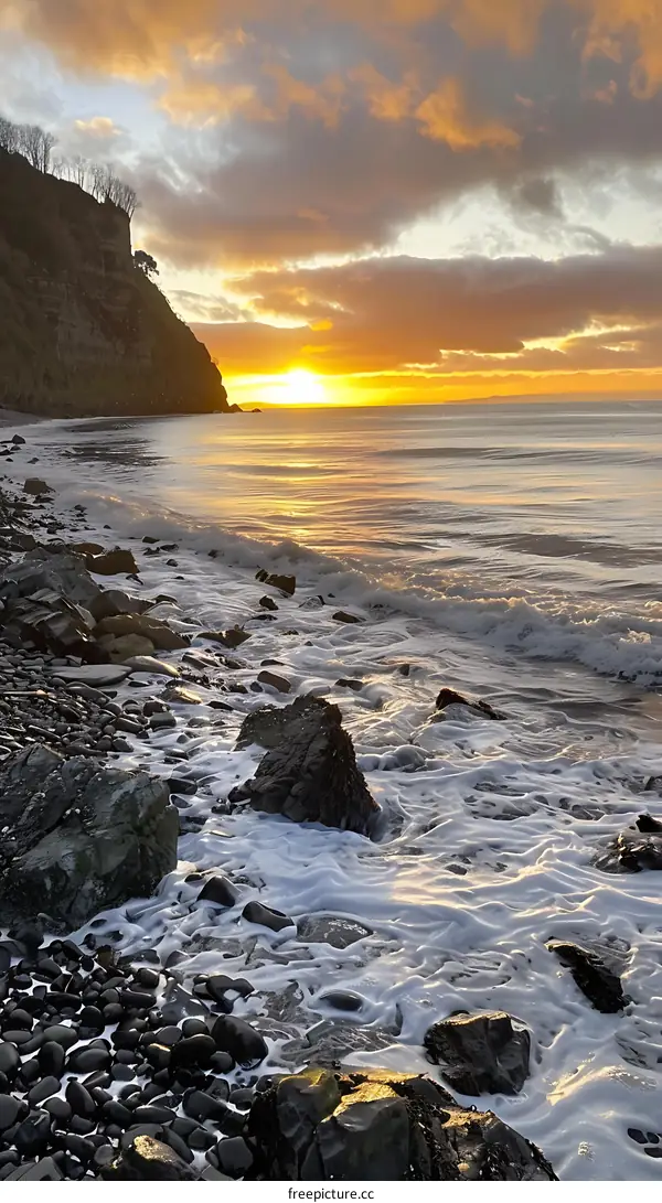 Golden Hour Sunset Over Rocky Coastline