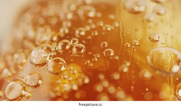 Close-up of bubbles in amber liquid