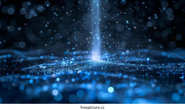 Blue glitter particles flowing in the air with a spotlight