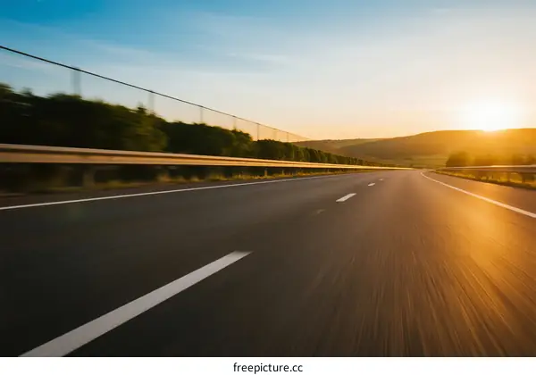 Sunset view of an empty highway with blurred motion effect