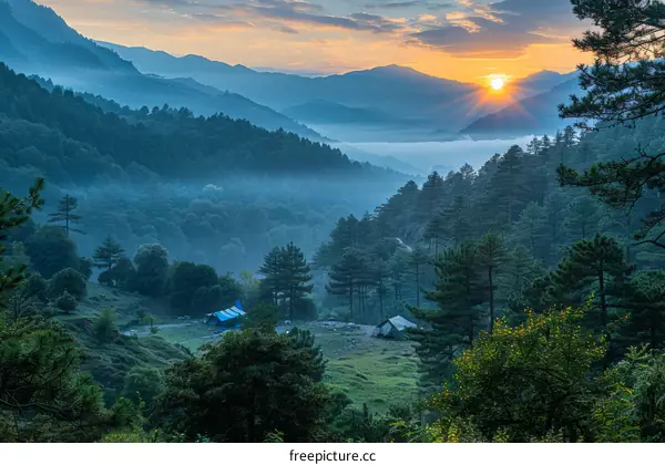 Sunrise over a Misty Valley in the Mountains