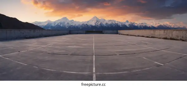 Rooftop Parking Lot with Snowy Mountain Views