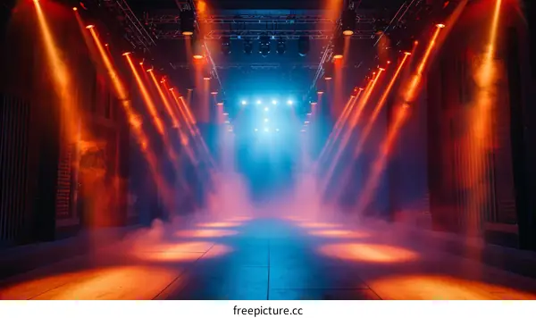 Empty stage with bright spotlights and smoke