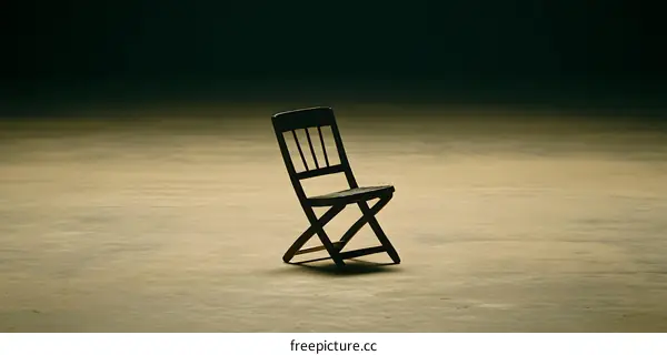 Simple Folding Chair On A Beige Surface