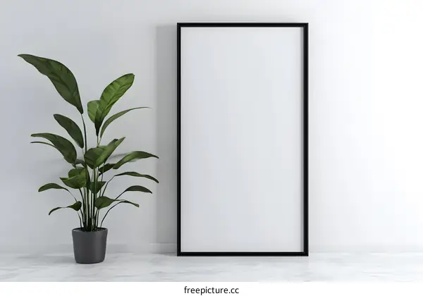 Blank Canvas Mockup with Green Plant and Black Frame