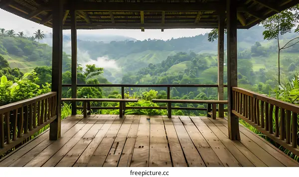 Wooden Deck with View of Green Mountains and Fog