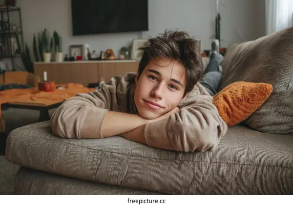 Teenage Boy Relaxing on Sofa at Home