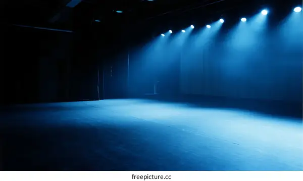 Stage with blue spotlights and empty space for performance