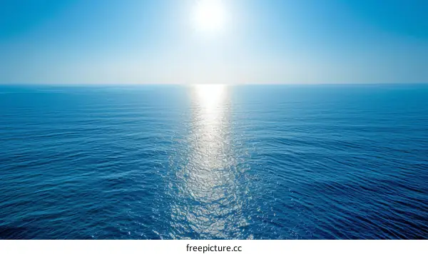 Blue ocean with bright shining sun above