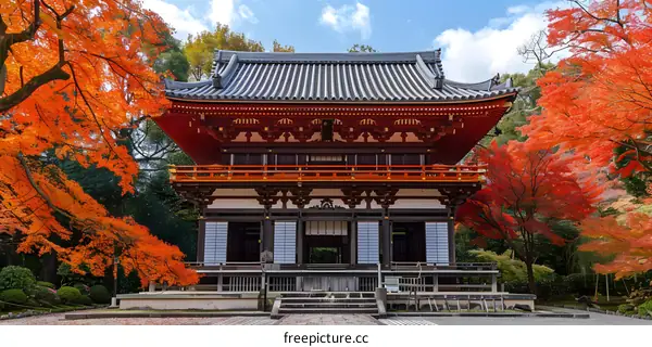 Japanese temple with red maple leaves in autumn