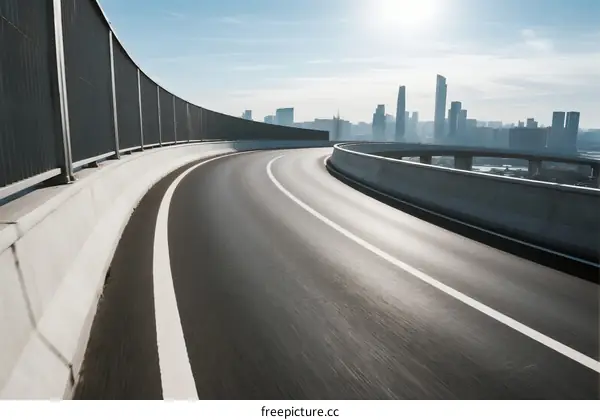 Smooth highway with city skyline in the background under clear sky