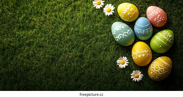 Colorful Easter Eggs on Green Grass Background