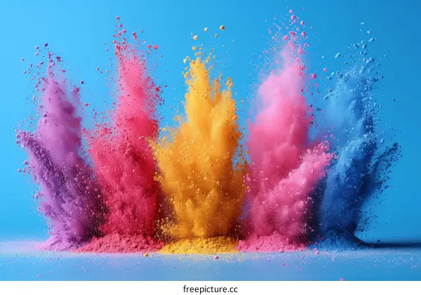 Colorful powder explosion on blue background