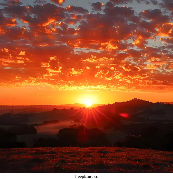 Sunset over rolling green hills