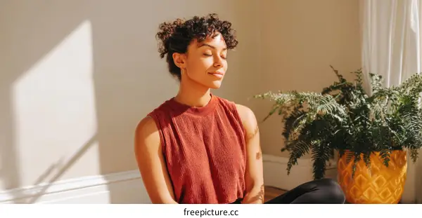 Relaxing Woman Meditating in Sunlight