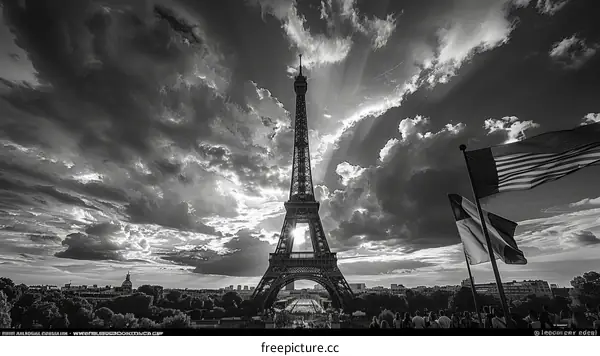 Black and white photography of the Eiffel Tower with a stormy sky in the background