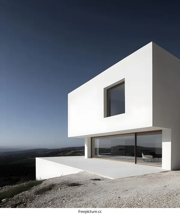 Modern Minimalist White House With Large Windows And A View Of The Countryside