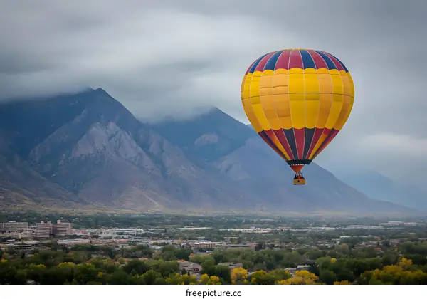 Hot Air Balloon Over Mountain Landscape