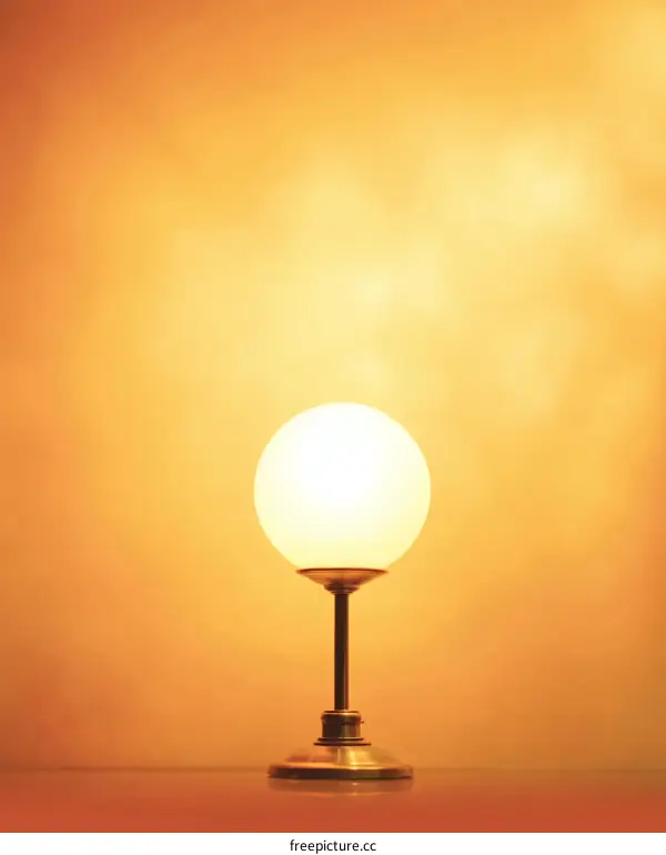 Warm Light Table Lamp Against a Soft Orange Background