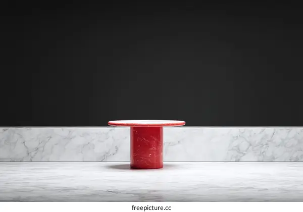 Red Marble Display Table Against Dark Background
