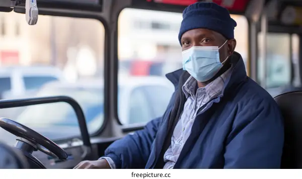 Black bus driver wearing a mask