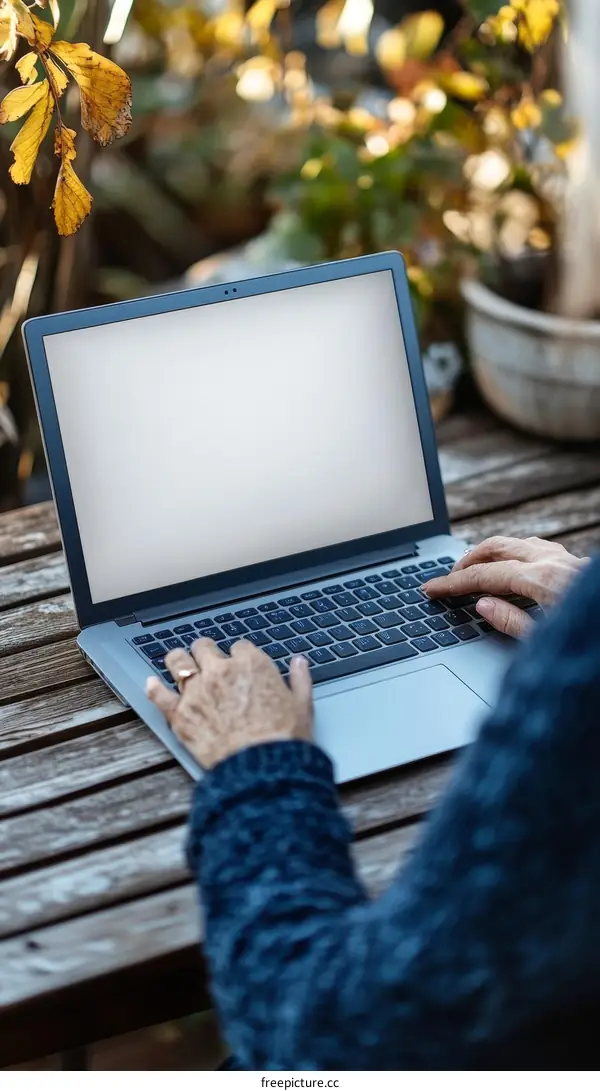 Outdoor Working With Laptop in Autumn Garden