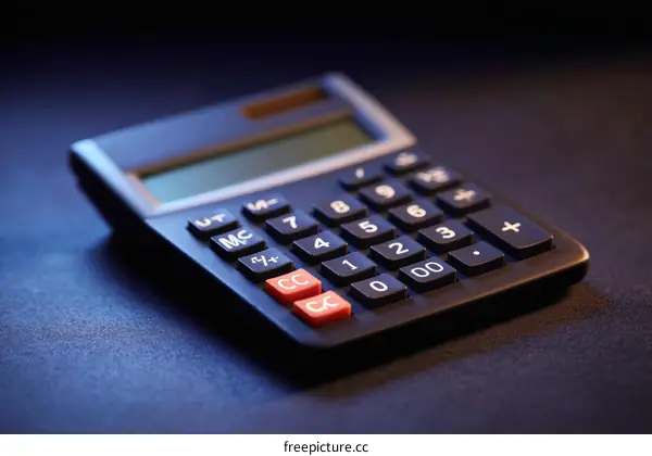 Closeup of a Modern Calculator on a Dark Surface