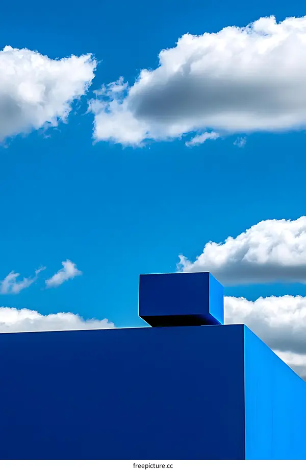 Blue Building and Sky with White Clouds