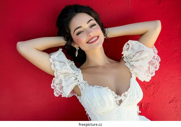 Woman in Vintage Lace Dress on Red Background