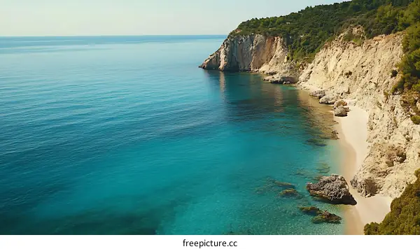 Aerial View of a Secluded Beach and Rocky Cliff