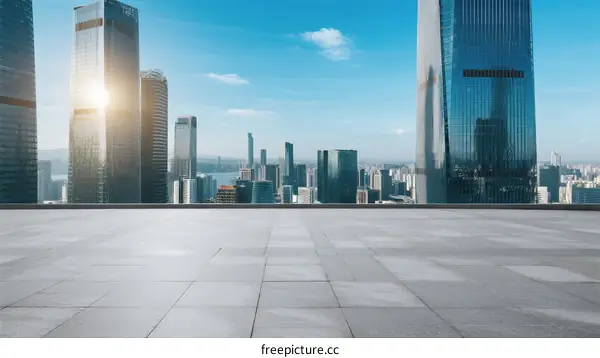 Modern city skyline with empty ground under clear blue sky