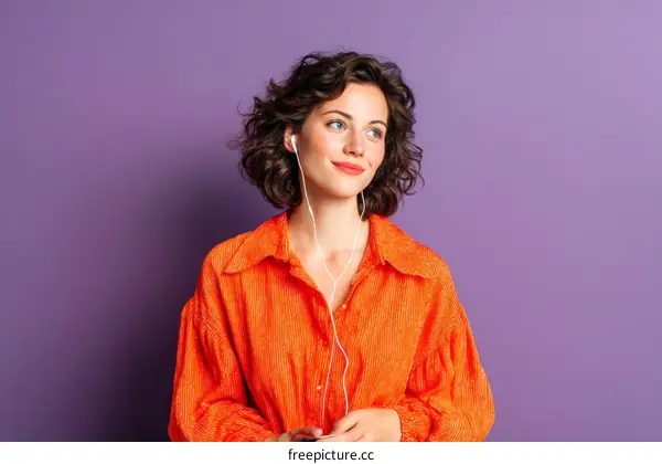 Woman Listening to Music Against a Purple Background