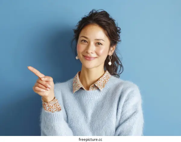 Asian Woman Pointing Direction Fashionable Portrait