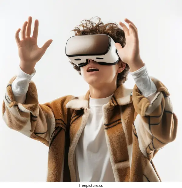 Amazed curly haired teenage boy wearing virtual reality headset