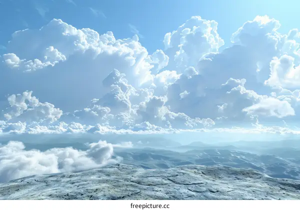 White Fluffy Clouds Above Mountain Range