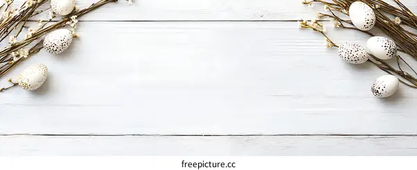 White Wooden Background with Easter Eggs and Flowers